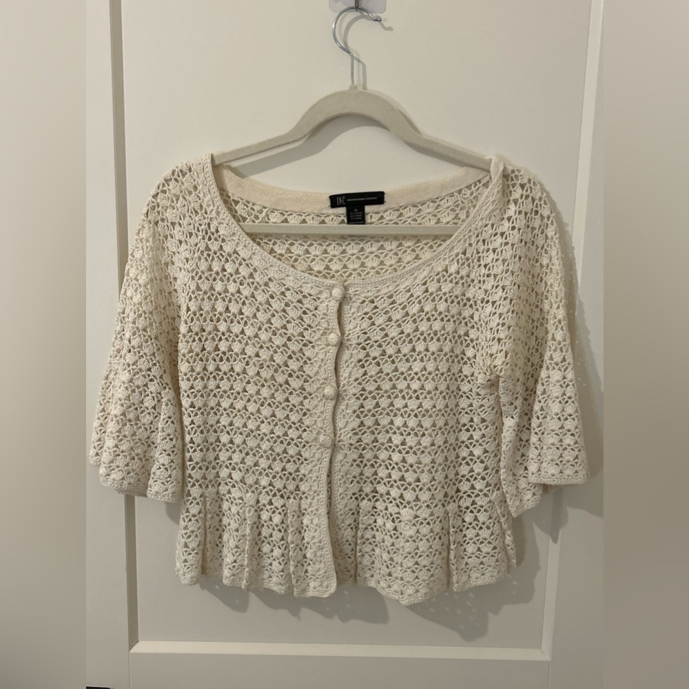 white crocheted flowy ruffled top